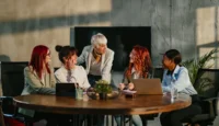Breaking Free from Complexity: Why Proxmox VE on PRIMERGY Is the Smarter Choice for Virtualization // Diverse group of women having a meeting in the office